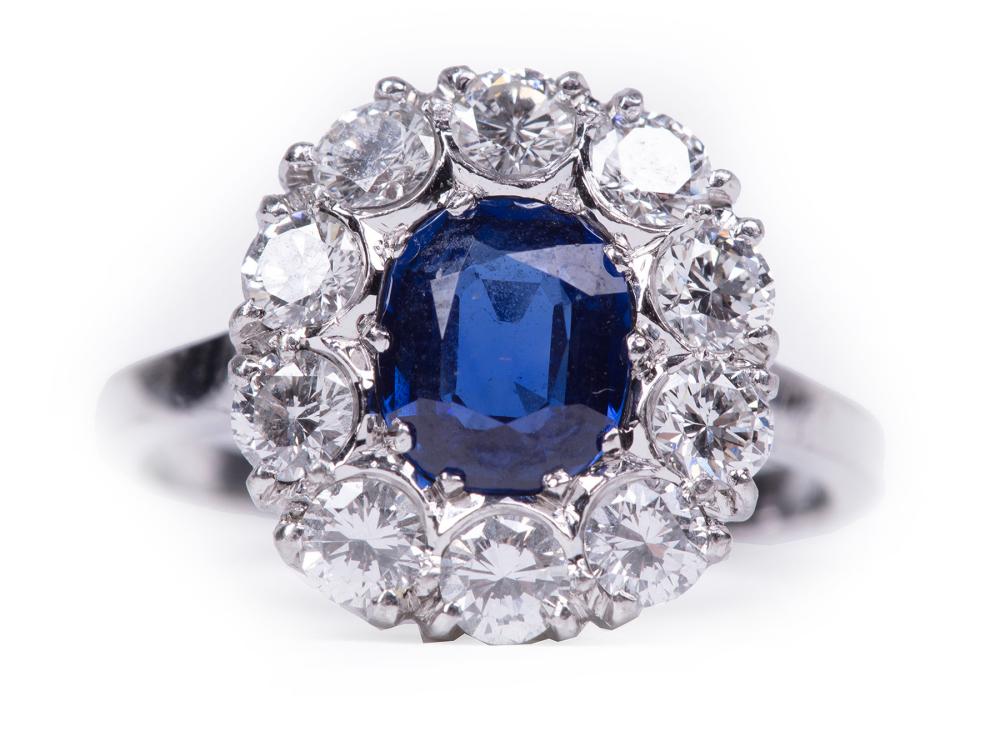 Appraisal: PLATINUM SAPPHIRE AND DIAMOND RINGPlatinum Sapphire and Diamond Ring center