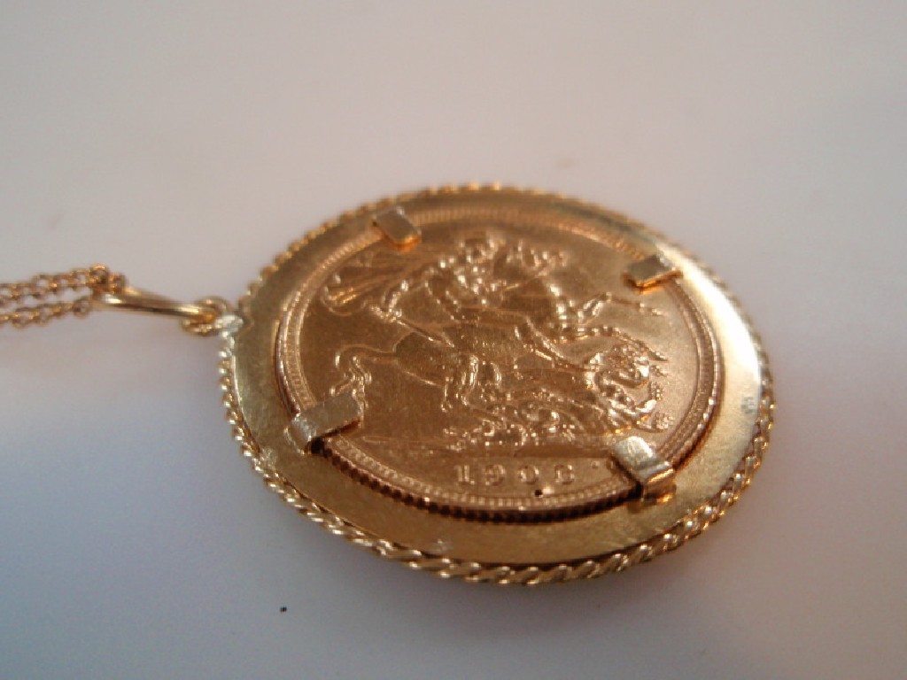 Appraisal: An Edward VII gold sovereign loose mounted in a pendant