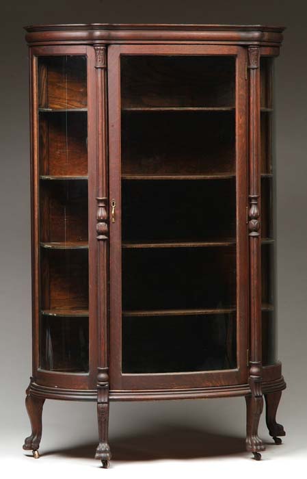 Appraisal: GOOD OAK BOW-FRONT CHINA CABINET Bowed glass sides with bowed