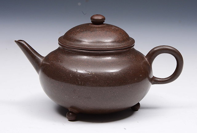 Appraisal: A CHINESE YIXING MINIATURE TEAPOT AND COVER brown glazed and