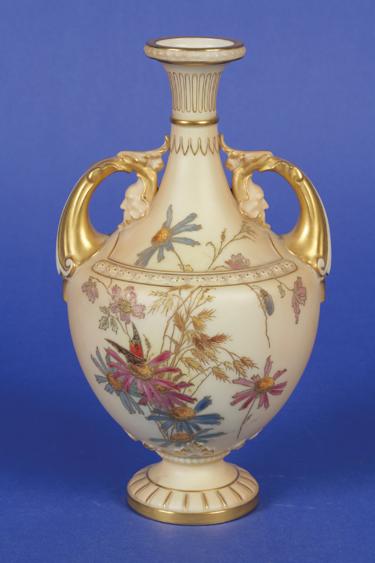 Appraisal: A ROYAL WORCESTER BLUSH IVORY VASE with gilt mask handles