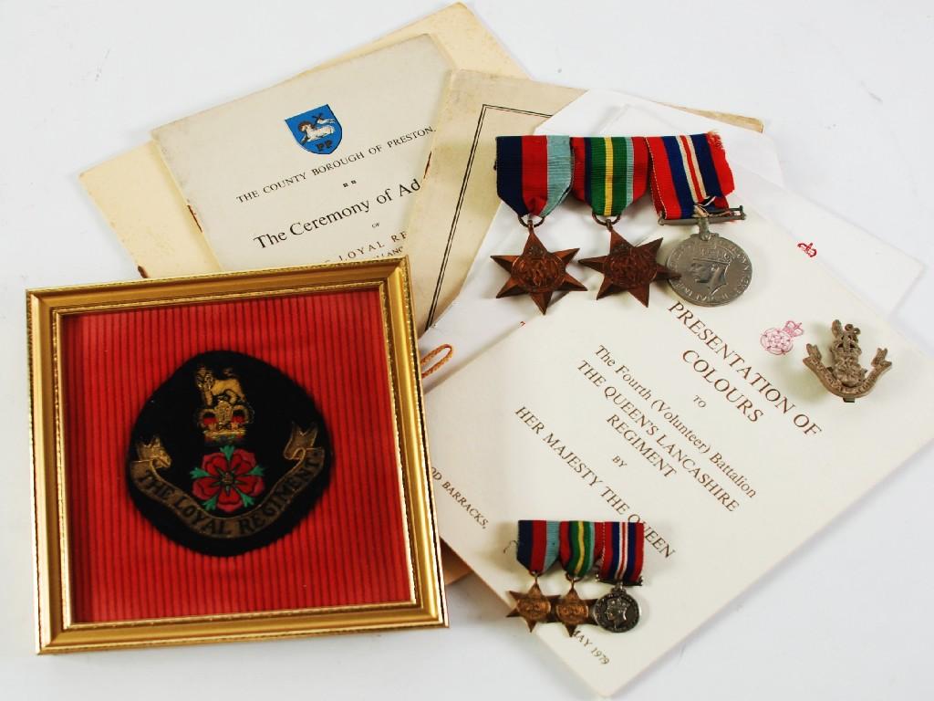 Appraisal: THREE WORLD WAR TWO SERVICE MEDALS attached to ribbon bar