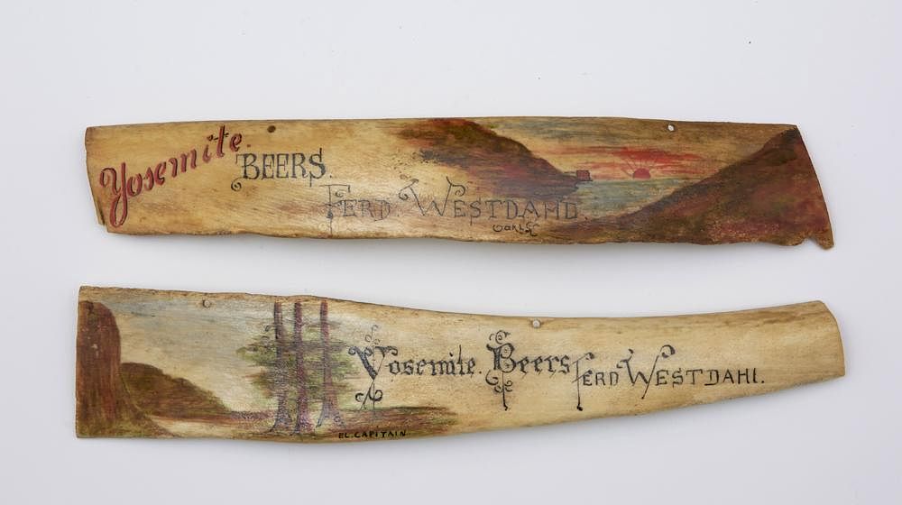 Appraisal: Two Yosemite Beer advertising pieces painted beef bone Two Yosemite