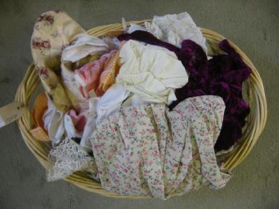 Appraisal: A quantity of dolls clothing various materials in a basket