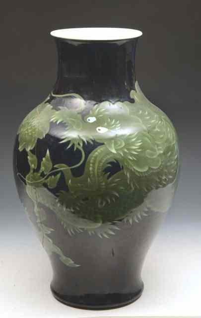 Appraisal: A JAPANESE COBALT BLUE GROUND BALUSTER VASE the exterior decorated