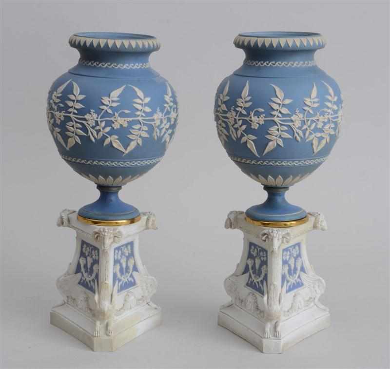 Appraisal: PAIR OF GEORGE III STYLE JASPERWARE URNS ON ASSEMBLED STANDS