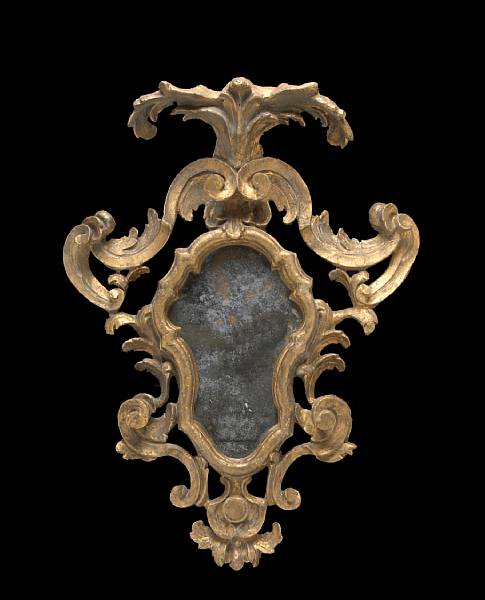 Appraisal: The cartouche shaped plate within a boldly carved frame of