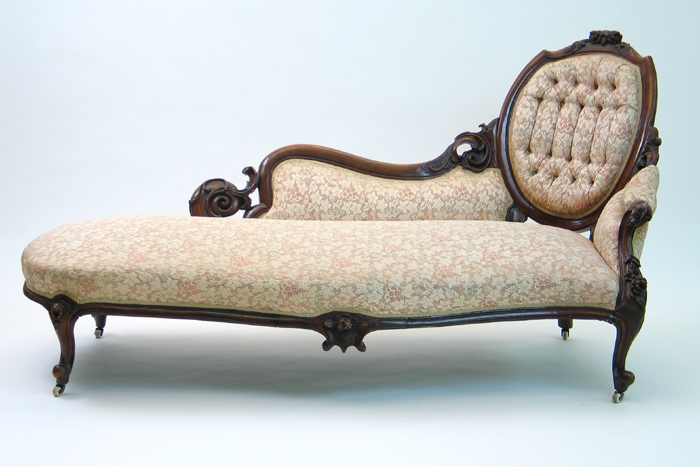 Appraisal: VICTORIAN CARVED WALNUT CHAISE LOUNGE English th century One end