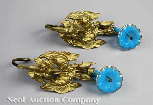 Appraisal: A Pair of Blue Opaline Gilded and Pressed Brass Tie