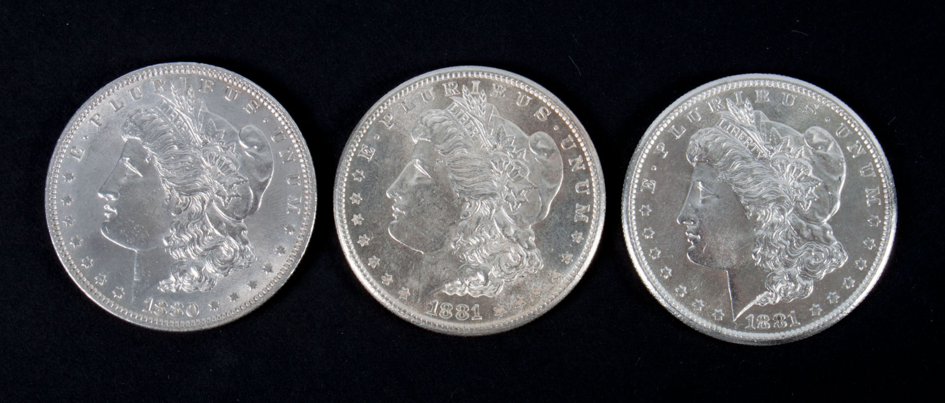 Appraisal: Three United States Morgan silver dollars -' comprising one and