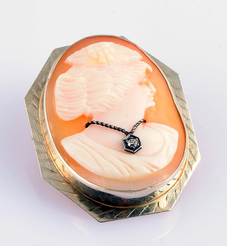 Appraisal: KW X Shell cameo with diamond accent pendant gms S