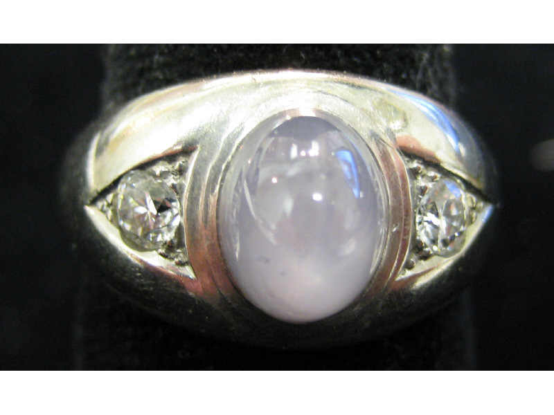 Appraisal: STAR SAPPHIRE AND DIAMOND RING White gold ring with bezel