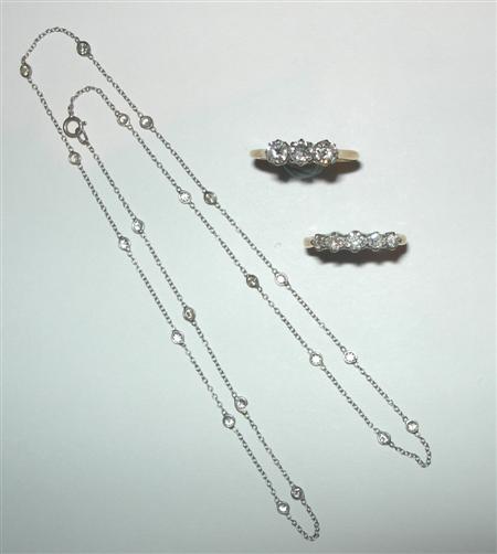 Appraisal: A spectacle set diamond necklace collet set at intervals with