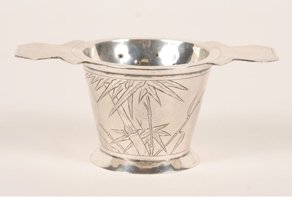 Appraisal: Chinese Export silver tea strainer on cup with engraved bamboo