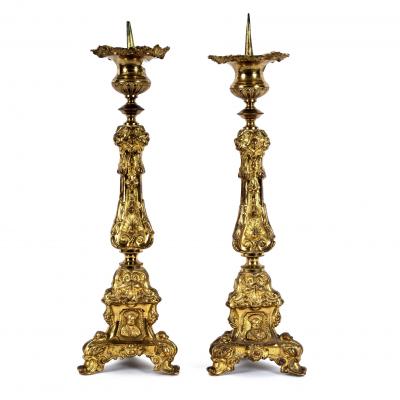 Appraisal: A pair of Continental gilt metal altar type candlesticks cm