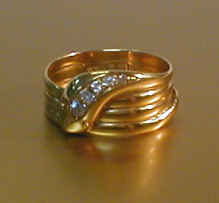 Appraisal: A gentleman's ring as a coiled snake with five diamond