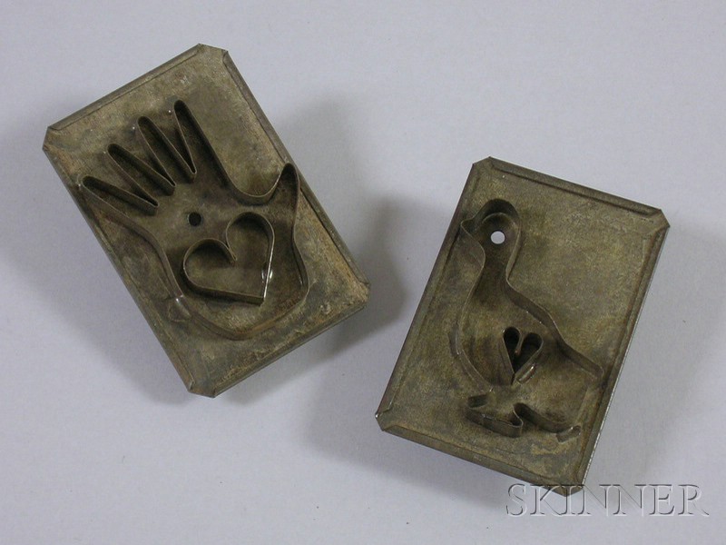 Appraisal: Two Tin Cookie Cutters one with heart in hand motif