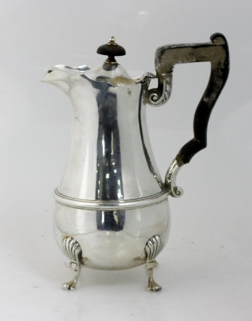 Appraisal: A silver hot water jug HW Sheffield of pear shape