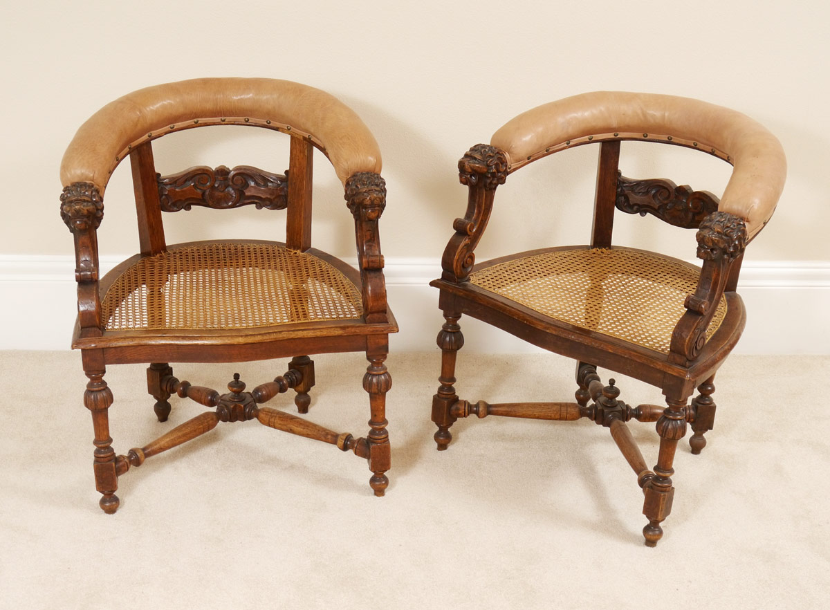 Appraisal: PAIR CARVED LION HEAD BARREL BACK CHAIRS Barrel back with