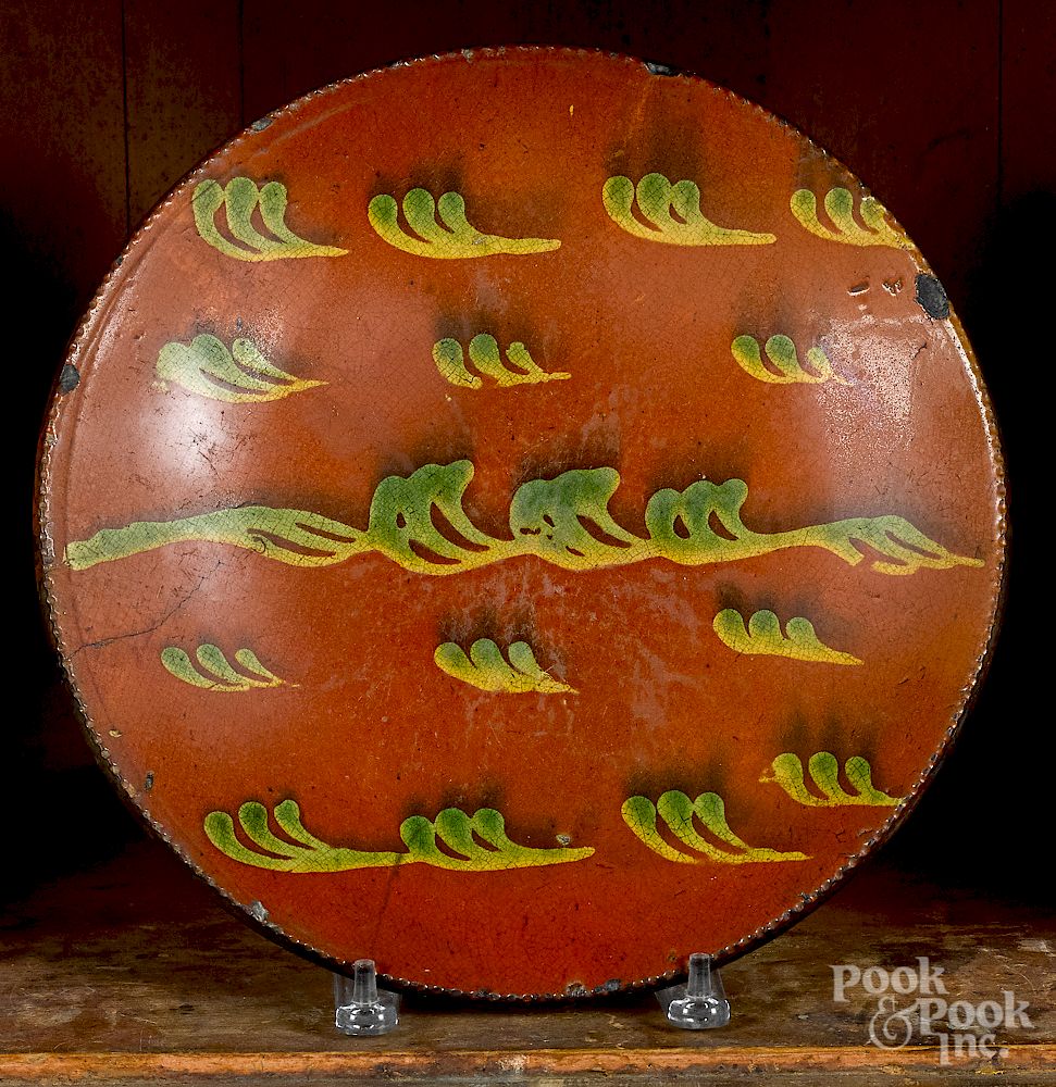 Appraisal: Pennsylvania redware charger Pennsylvania redware charger mid th c probably