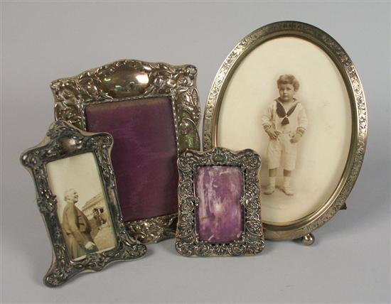 Appraisal: FOUR SILVER PICTURE FRAMES height of largest inches Provenance Property