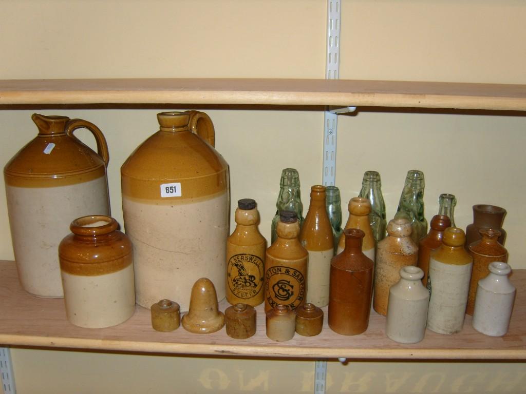 Appraisal: A collection of stoneware flagons bottles and jars including bottles