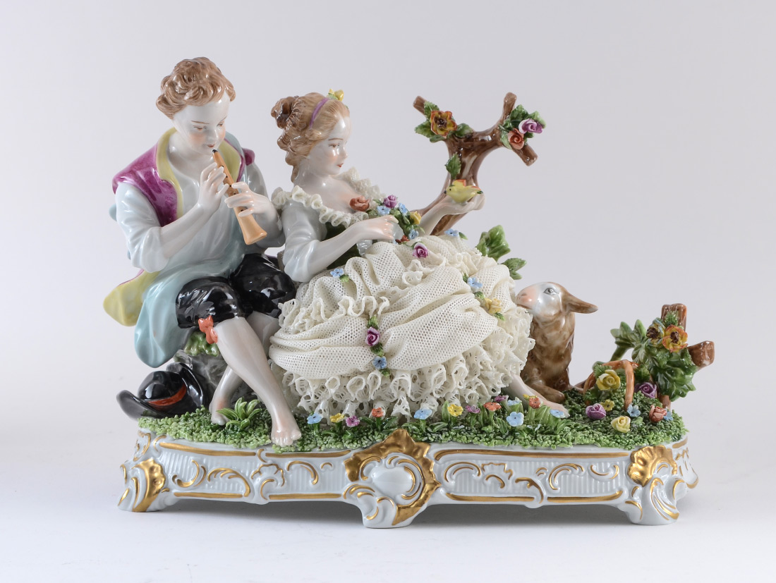 Appraisal: VEB UNTERWEISSBACH LACY PORCELAIN FIGURAL GROUP Figural group with boy