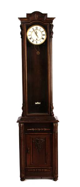 Appraisal: A Continental mixed wood tall case clock with the lower