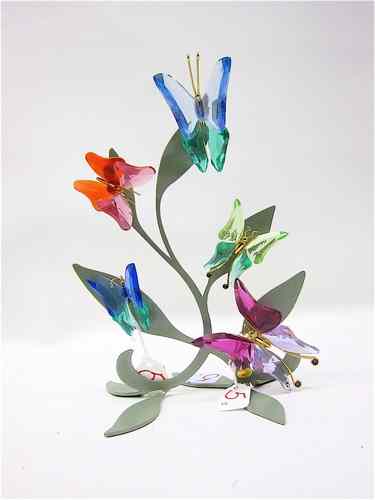 Appraisal: FIVE SWAROVSKI CRYSTAL BUTTERFLIES PLUS METAL STAND the magnetic butterflies