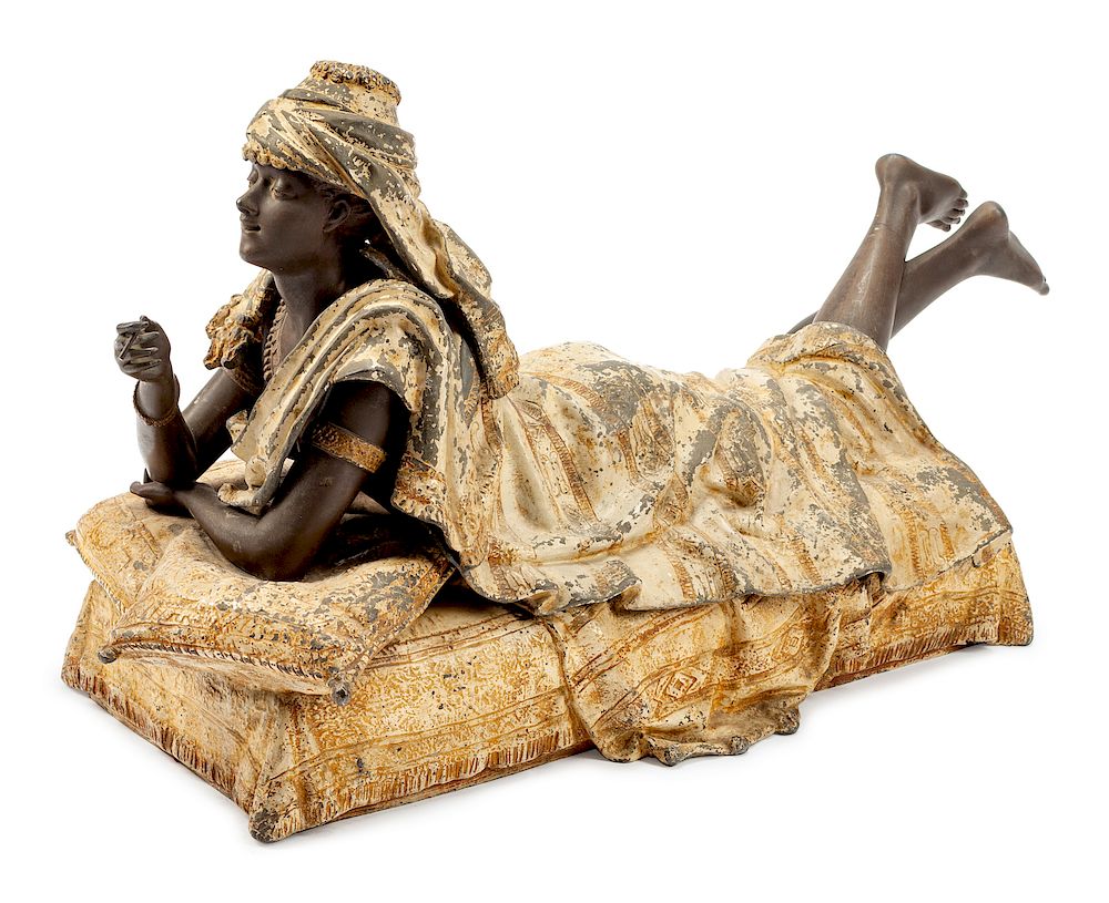 Appraisal: A Large Cold-Painted Metal Erotic Figure of a Reclining Woman