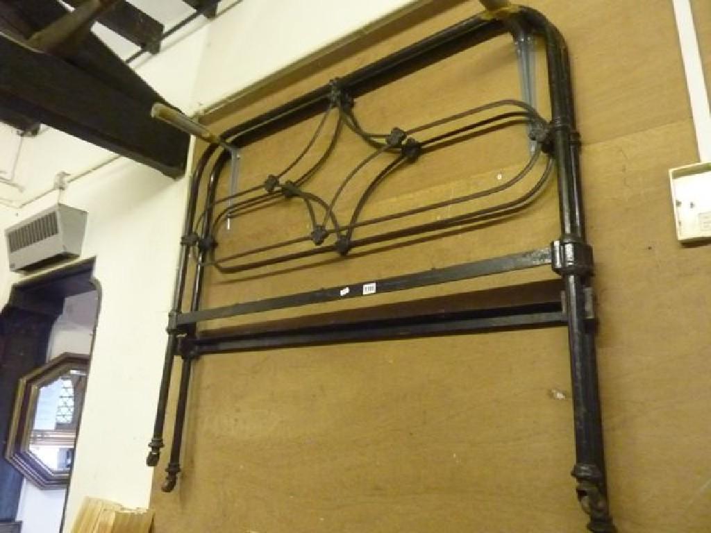 Appraisal: A Victorian cast iron bedstead of arched form with decorative