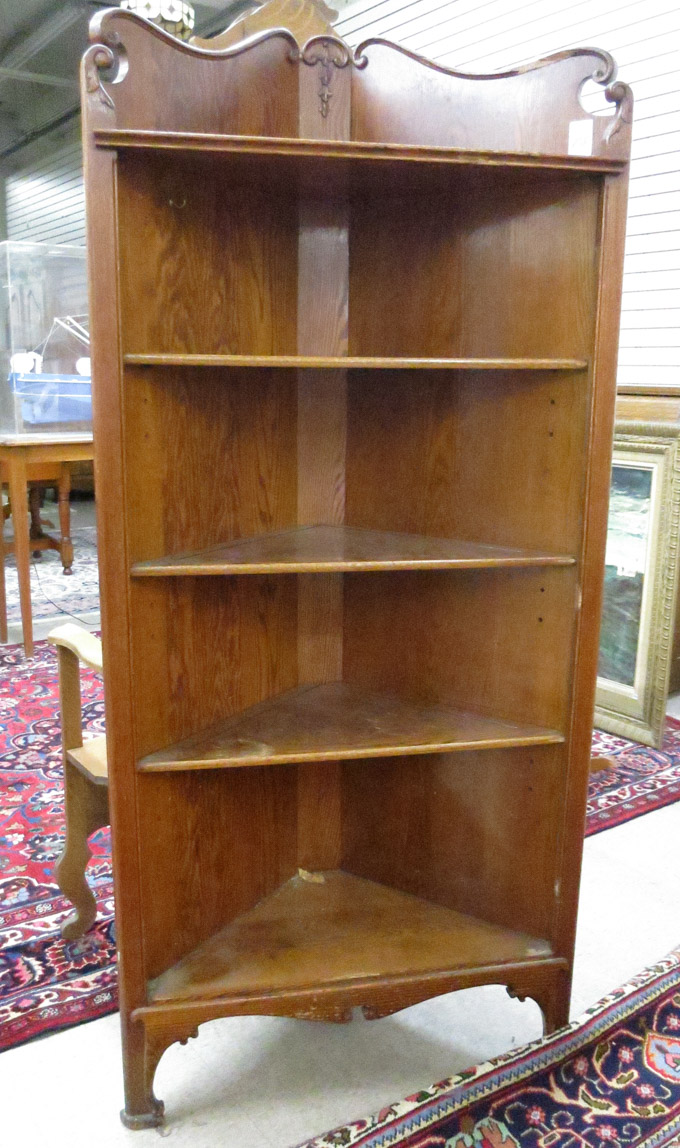 Appraisal: AN OAK CORNER CHINA CABINET American c a triangular cabinet