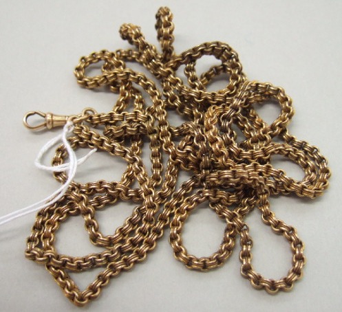 Appraisal: A Victorian gold decorated twin circular link long guard chain