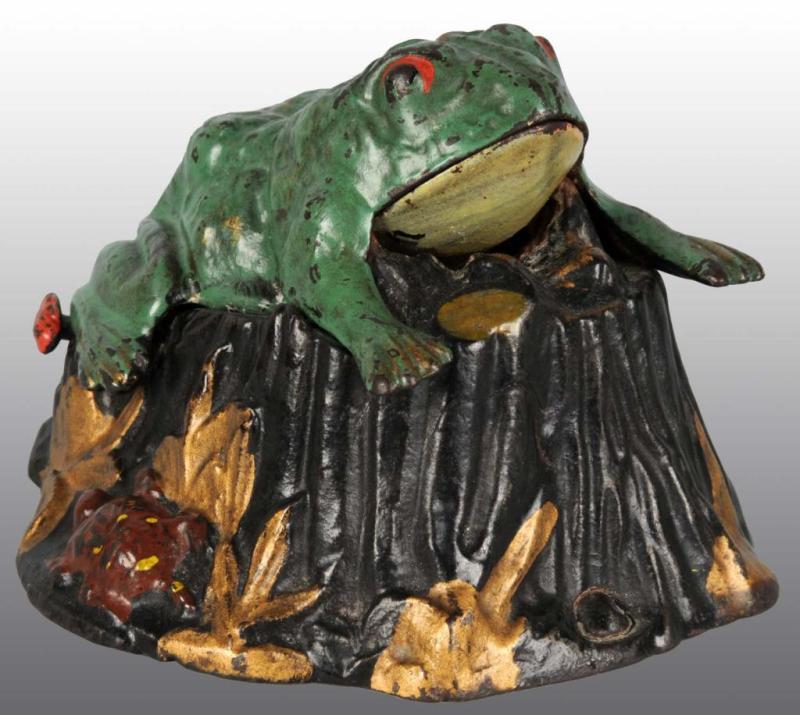 Appraisal: Cast Iron Toad on Stump Mechanical Bank Description Manufactured by