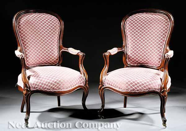 Appraisal: A Pair of American Victorian Mahogany Open Armchairs mid- th