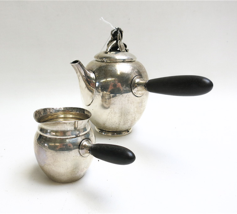 Appraisal: GORHAM STERLING SILVER TEAPOT AND CREAM PITCHER SET with rosewood