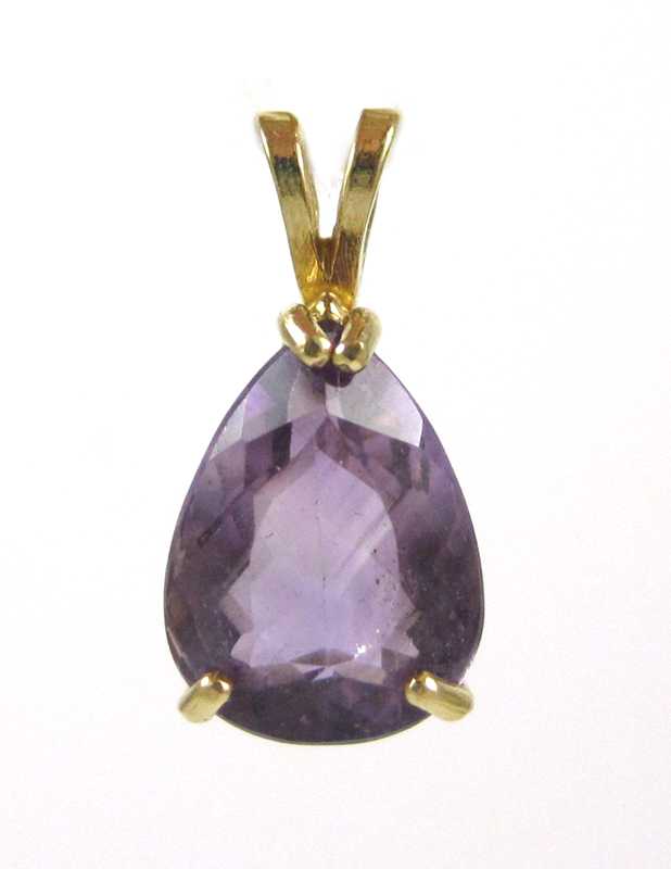 Appraisal: FOURTEEN KARAT GOLD AND AMETHYST PENDANT the pear-cut amethyst set