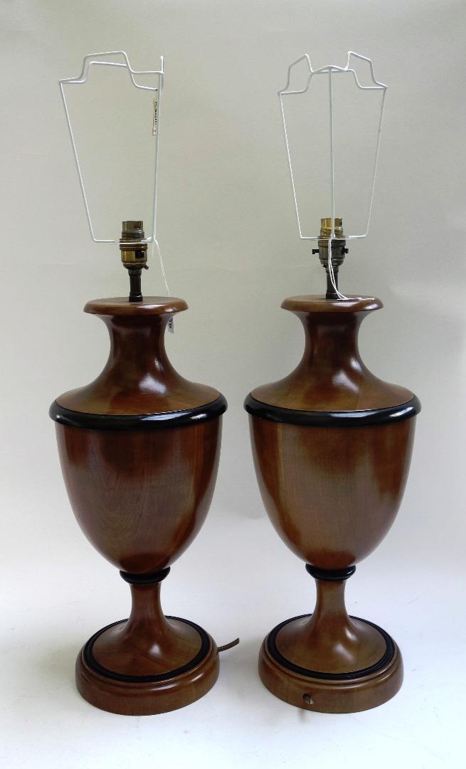 Appraisal: A pair of modern fruitwood table lamps each of urn