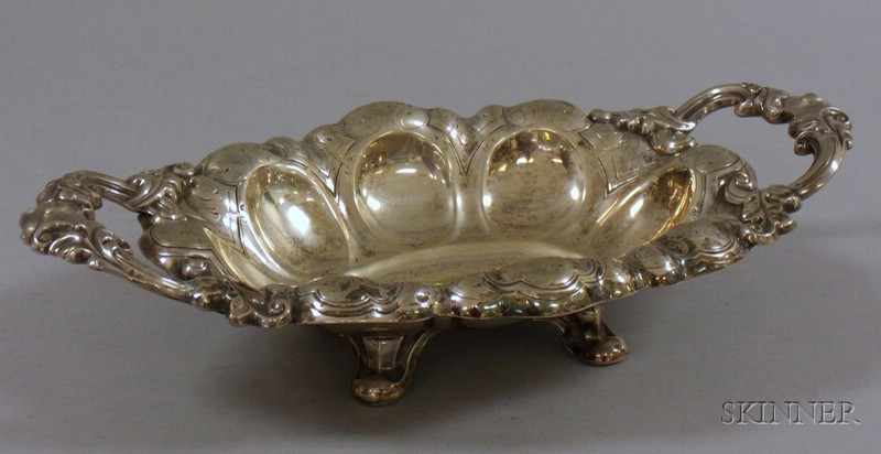 Appraisal: Rococo-style Silver Handled and Footed Serving Dish bulbous edge with