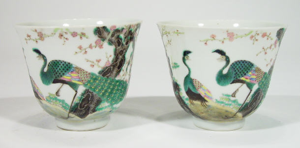 Appraisal: Two Oriental flared porcelain tea bowls enamelled with peacocks amongst