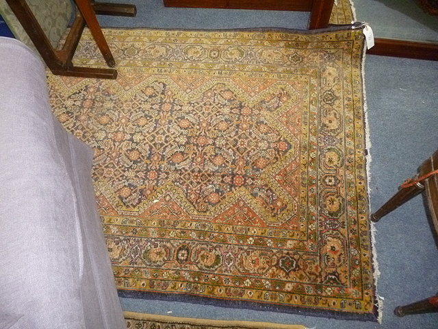 Appraisal: A TABRIZ POLYCHROME RUG the central blue ground panel within