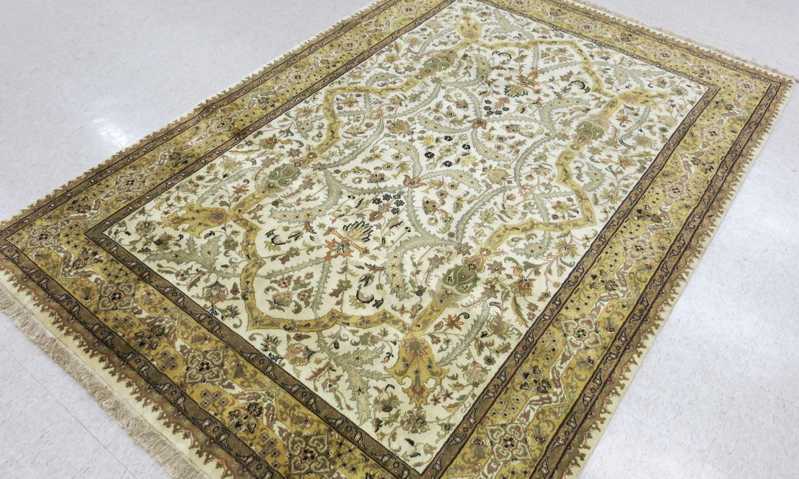 Appraisal: HAND KNOTTED ORIENTAL CARPET Indo-Persian overall floral design on cream