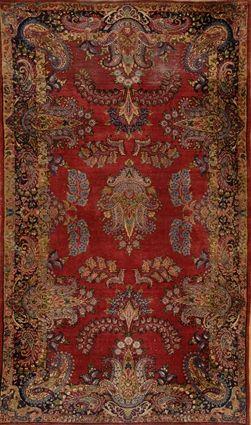 Appraisal: KIRMAN RUG Worked with stylized tiered floral medallions and branches