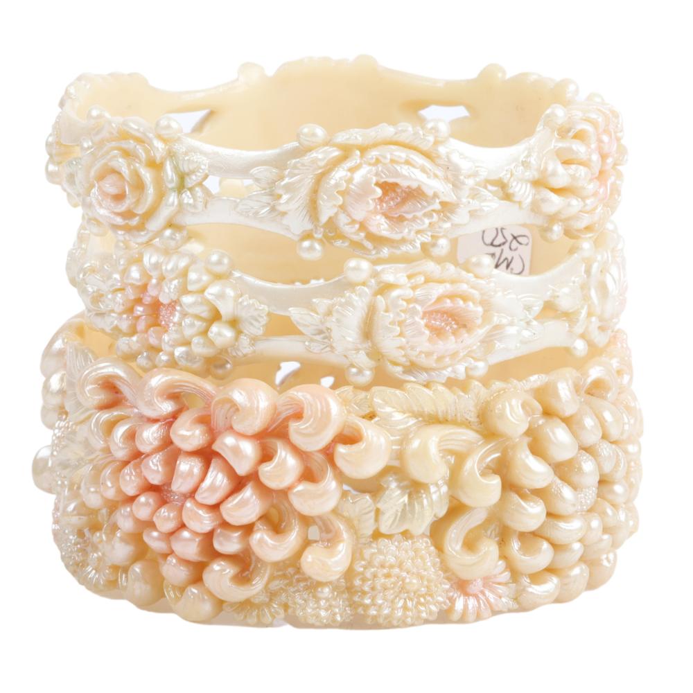 Appraisal: THREE PEARLIZED IVORY CELLULOID PIERCED AND CARVED DAHLIA FLOWER BRACELETS