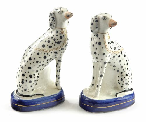 Appraisal: A pair of th century Staffordshire dalmations sitting on blue