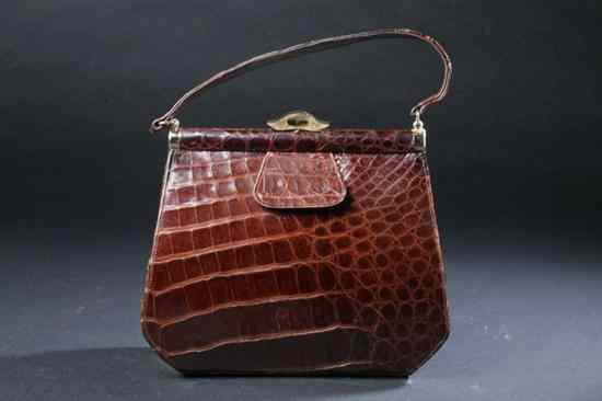 Appraisal: VINTAGE STERLING POLISHED BROWN ALLIGATOR HANDBAG s interior with gilt