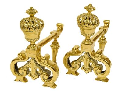 Appraisal: A pair of Victorian brass fire dogs with pierced urn