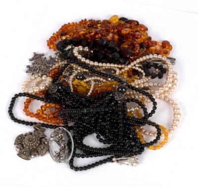 Appraisal: A quantity of costume jewellery including amber bead necklaces faux