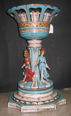 Appraisal: A PORCELAIN FIGURAL JARDINIERE PLANT STAND hand painted having four