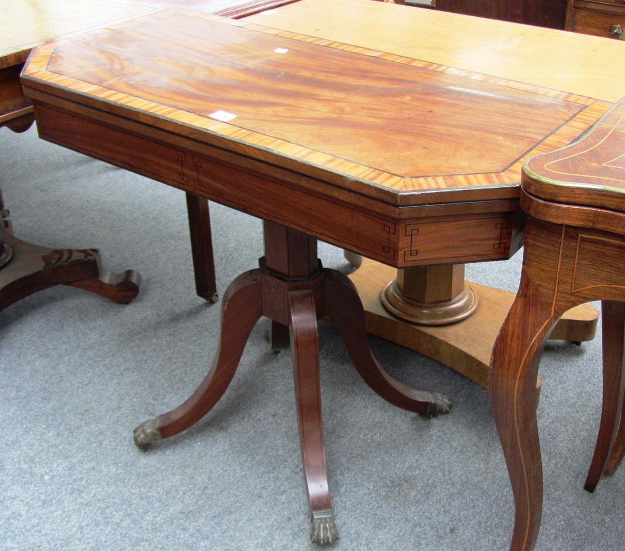 Appraisal: A Regency mahogany and crossbanded tea table the canted rectangular